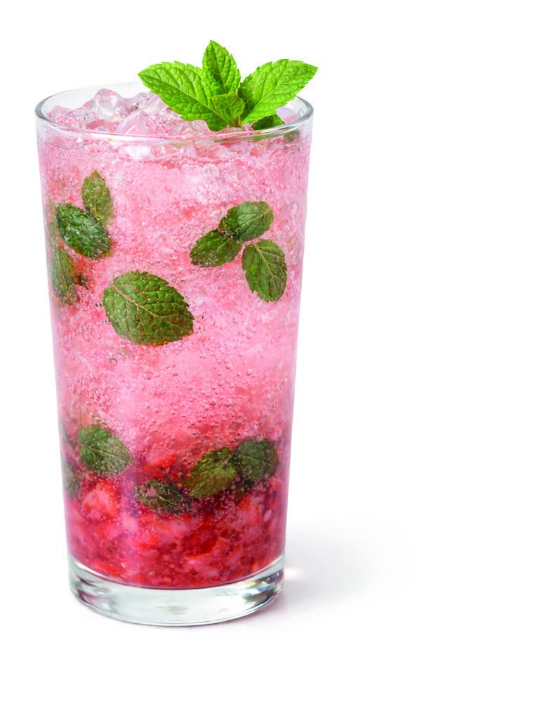 A tall glass of protein berry mojito with crushed strawberries, mint and ice.